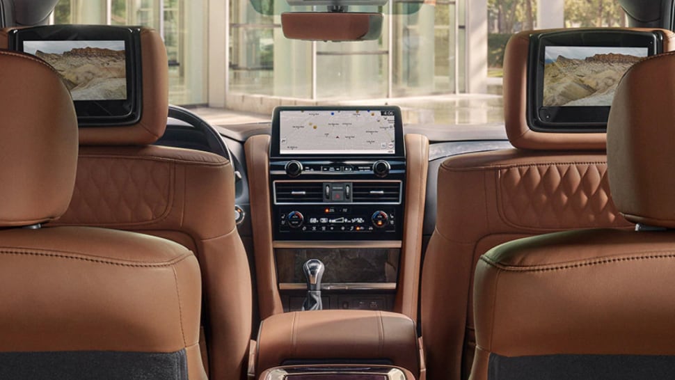 Interior of 2024 INFINITI QX80 highlighting rear seat dual 8 inch entertainment screens